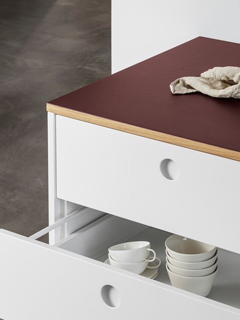 White kitchen drawers and linoleum countertop